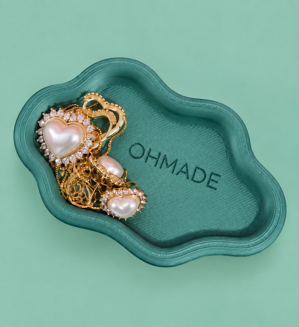 Cloud jewellery tray with a custom logo holding pearl earrings