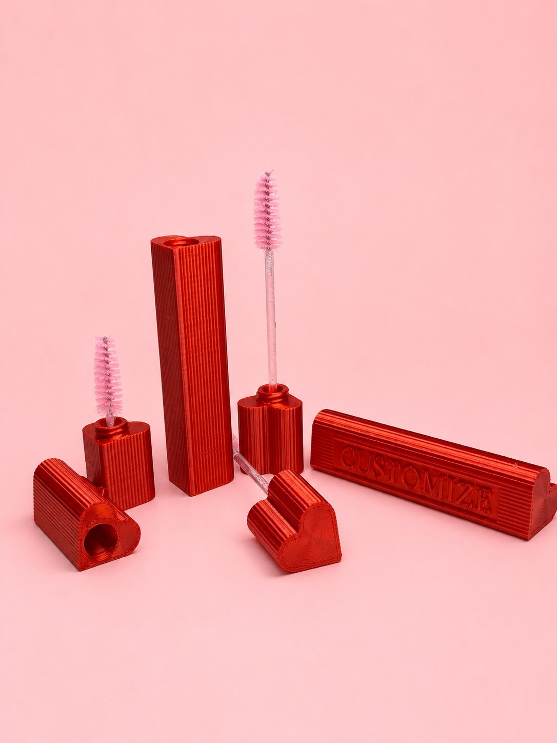 Red heart-shaped lash wand holders, tall and short
