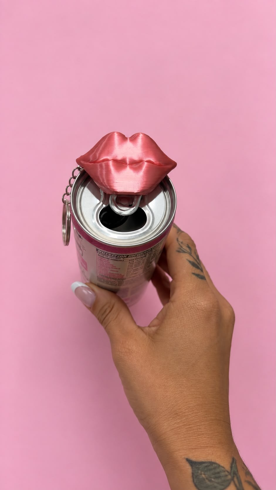 Coral satin lip can opener on an open can