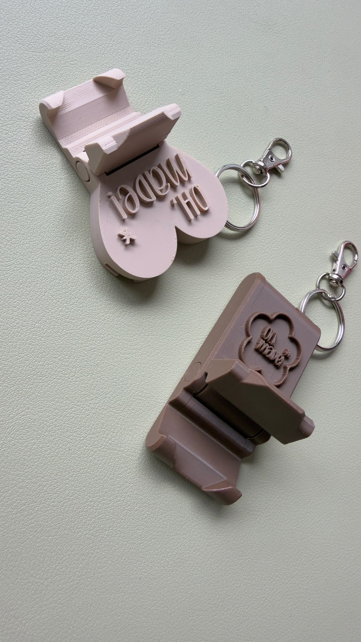 Phone stand keychains with the OH, MADE! logo
